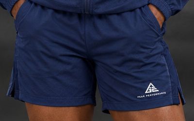 GE navy blue women's shorts with side pockets, small side-hem splits and a white GE Peak Performance logo.