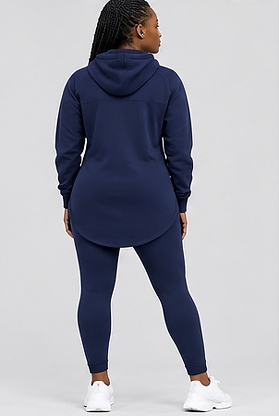 Back view of the GE navy blue elongated hoodie and leggings showing the hood and curved longline hem.